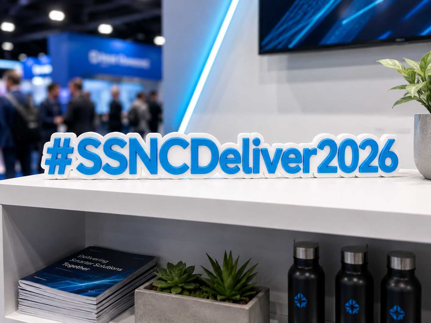 Conference hashtag sign displayed on a shelf at a trade show booth