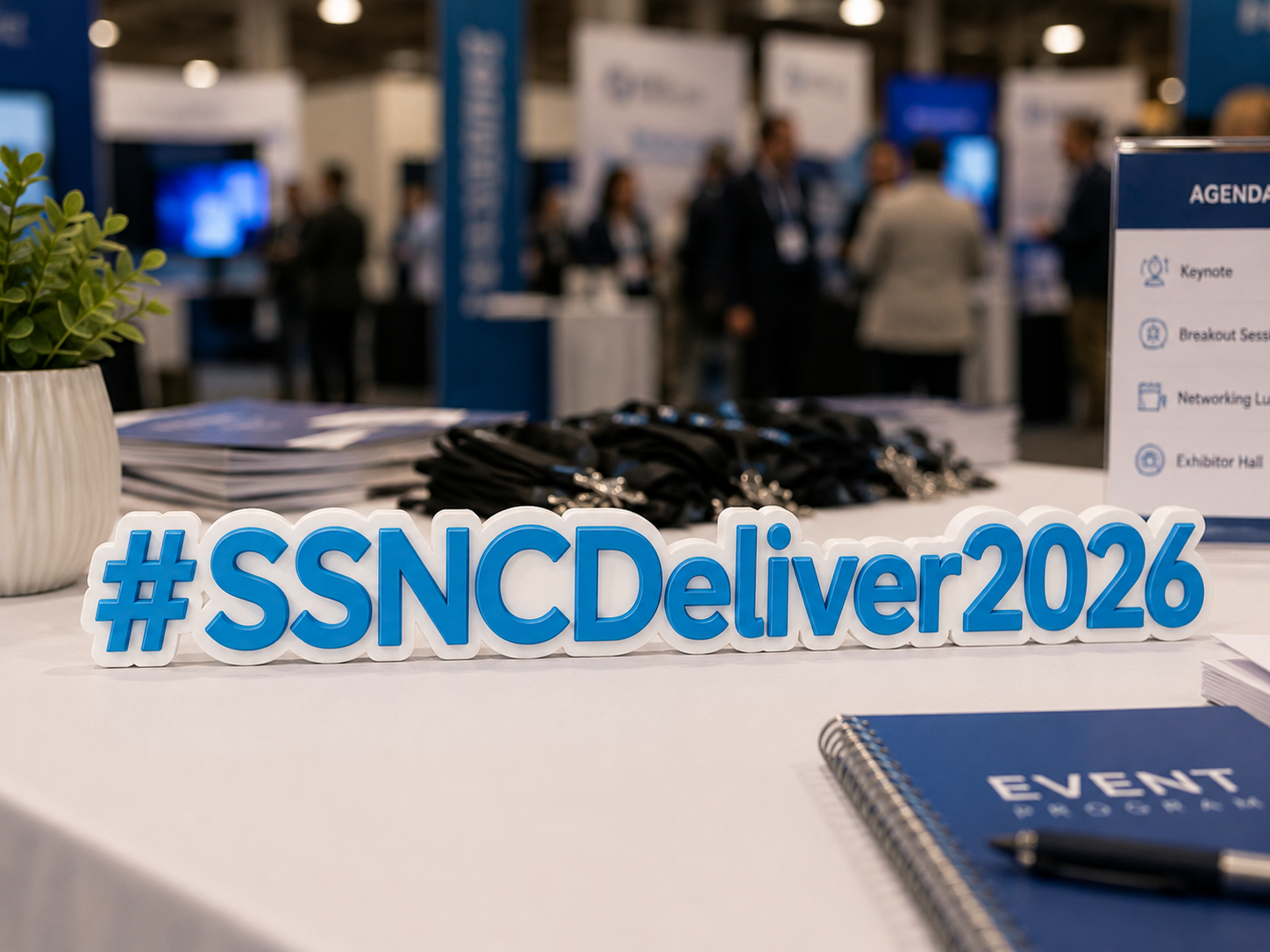 Custom conference hashtag sign displayed on a registration or booth table